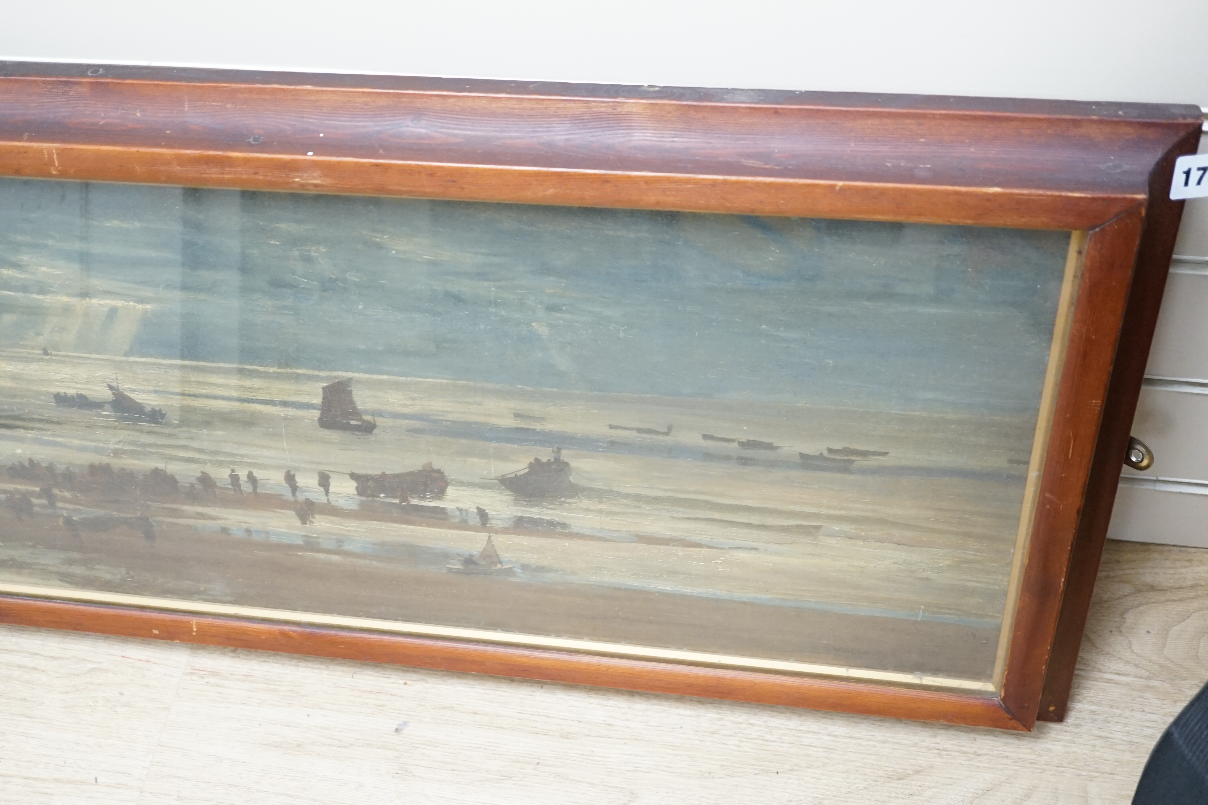 Manner of William Lionel Wyllie (1851-1931), oil on canvas, Panoramic coastal view with fishing boats, bears signature, 31 x 86cm. Condition - poor to fair